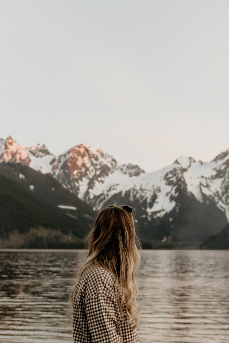 Woman near the Lake in the Mountains